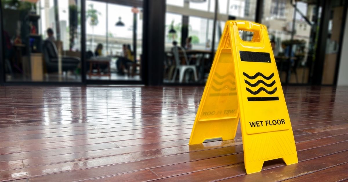 Can I Collect Compensation for Slipping on a Wet Floor Without a Caution Sign?